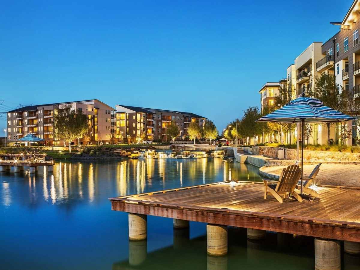 Luxury living on the water with docs that have chairs and umbrellas for article Highland Village Texas for newcomer moving to DFW or within Dallas-Fort Worth area.