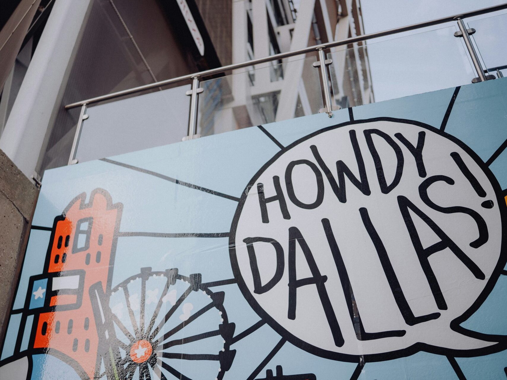 picture of mural with state fair ferris wheel and text saying "Howdy Dallas!"