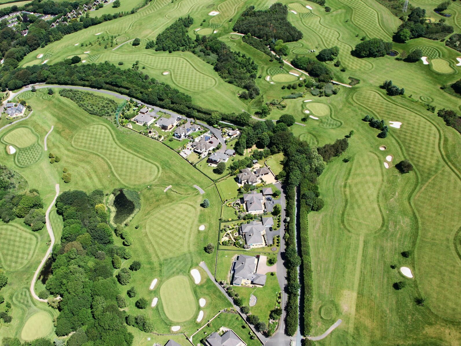 aerial view of a golf course in the daytime