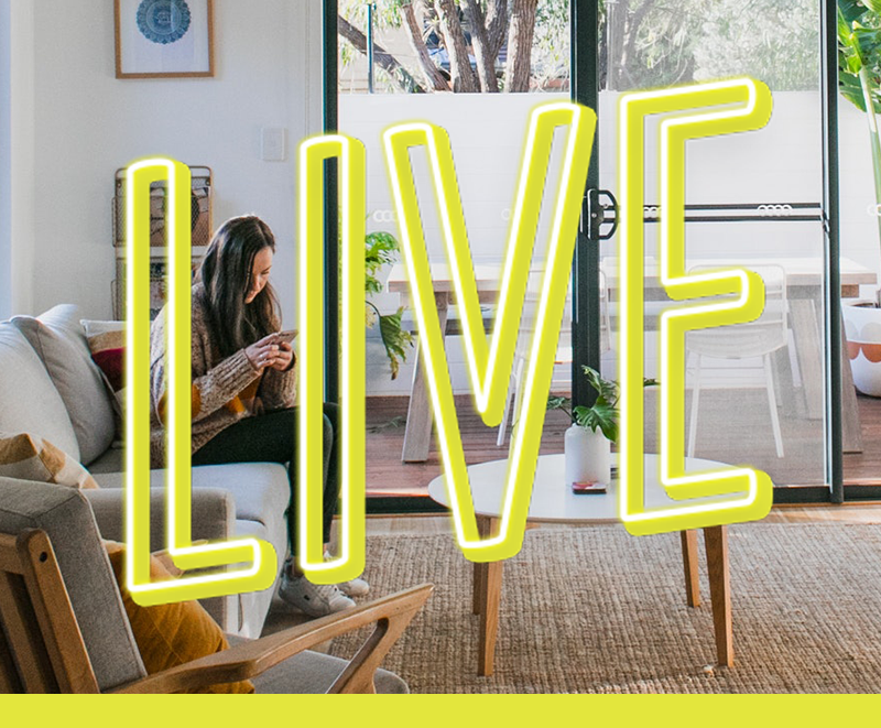 Woman sitting on couch looking at cellphone; LIVE, bright, neon letters on top