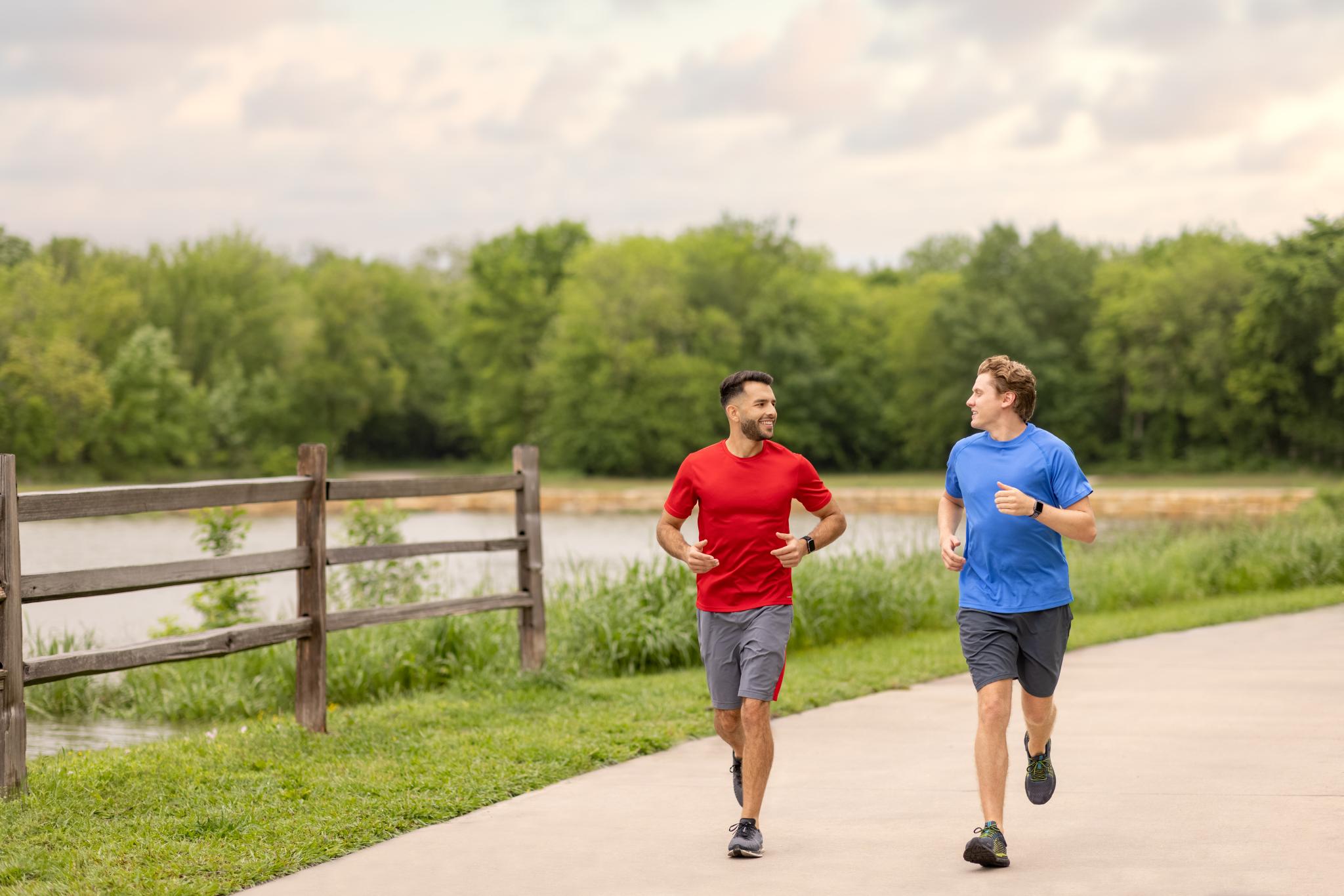 2 runners at Oak Point Park Nature Preserve in Plano, TX.