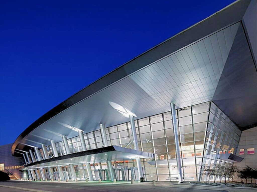 Kay Bailey Hutchinson Convention Center in Dallas - modern architecture showing entrance of center for article DFW Sports, Tourism, and Conventions for newcomers moving to DFW.