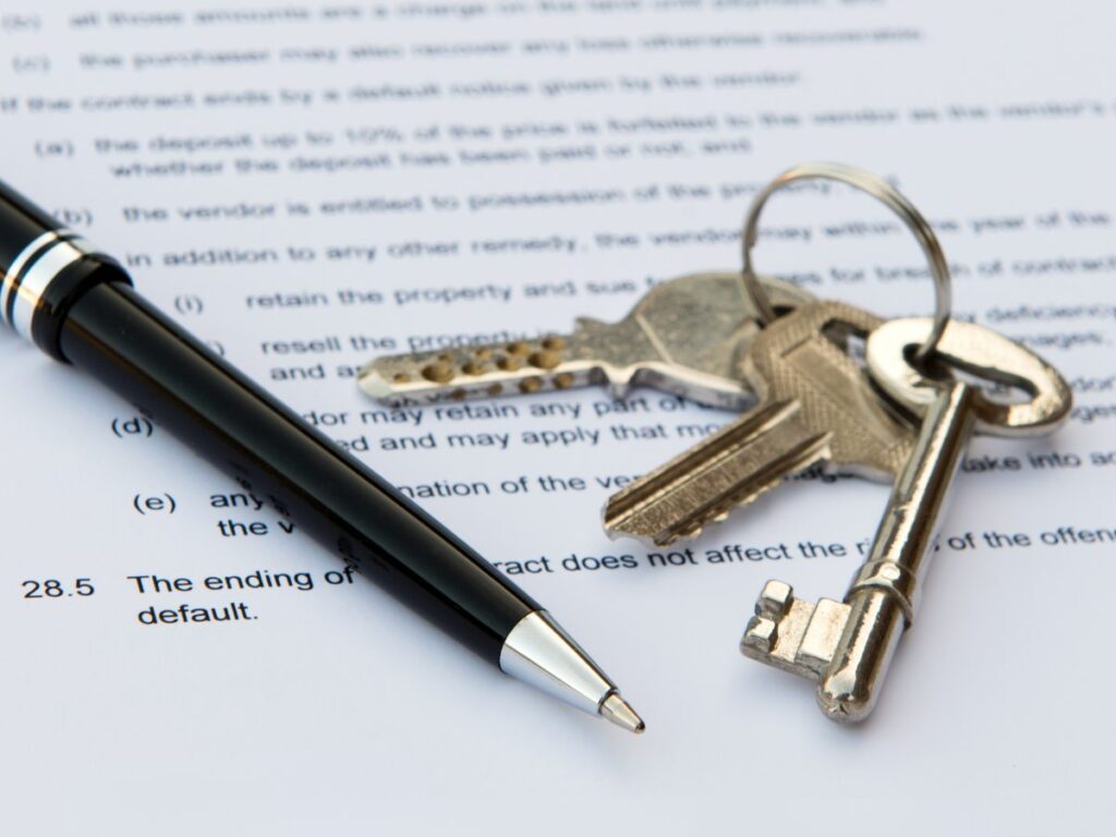 Contract with a pen and house keys laying on top of it for article Understanding Backup Contracts in DFW’s Housing Market for newcomers moving to DFW.